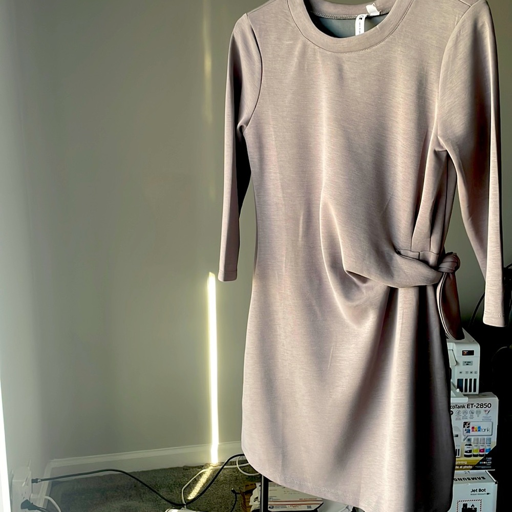 New never worn ..Gray dress loose fit short , to the knees , very comfortable